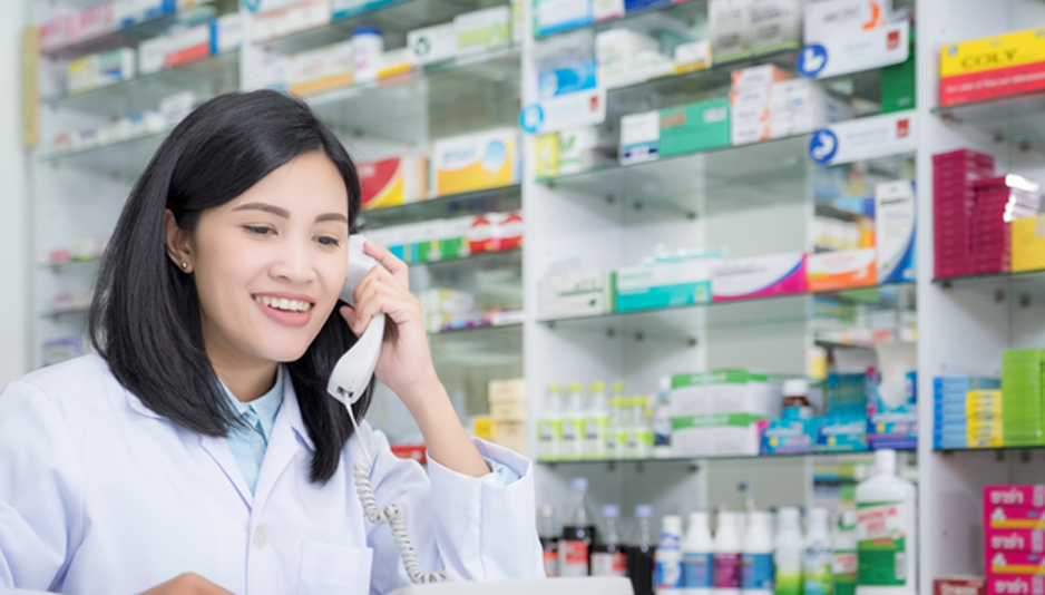 Female-pharmacist-talking-on-the-phone-at-a-hospice-pharmacy-in-Sherman-Oaks