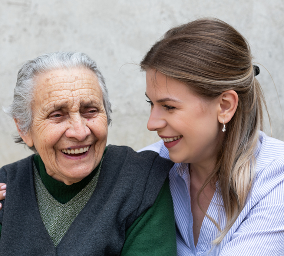 Hospice-nurse-embracing-an-elderly-woman