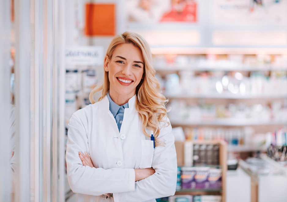 Smiling-female-pharmacist-with-her-hands-folded-at-a-hospice-pharmacy-in-Lancaster