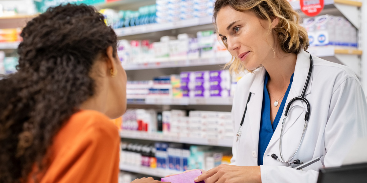 Commercial-pharmacist-discussing-medication-with-customer